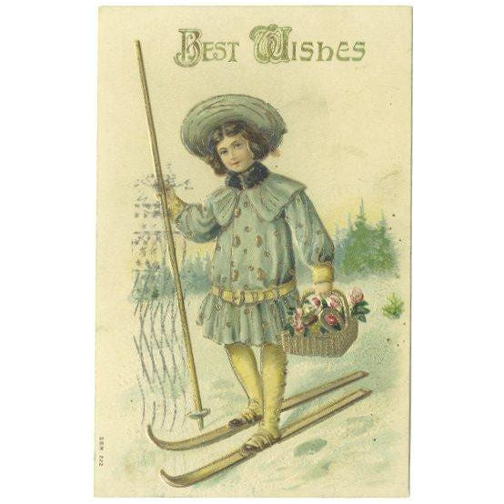 Antique Best Wishes Greetings Postcard 1910s Boy on Snow Skies Basket of Flowers - Avid Vintage