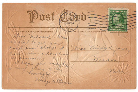 Vintage 1910s Embossed Christmas Postcard Baby Girl in White Bunting Bag Red Poinsettias - Avid Vintage